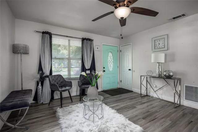 a living room with furniture and a window