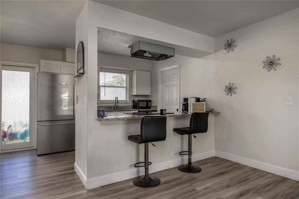 15872 Southwest 133rd Lane Archer, FL 32618 - Photo 17 of 28 a kitchen with a refrigerator and a table