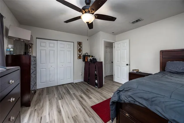 a bedroom with a bed and a dresser