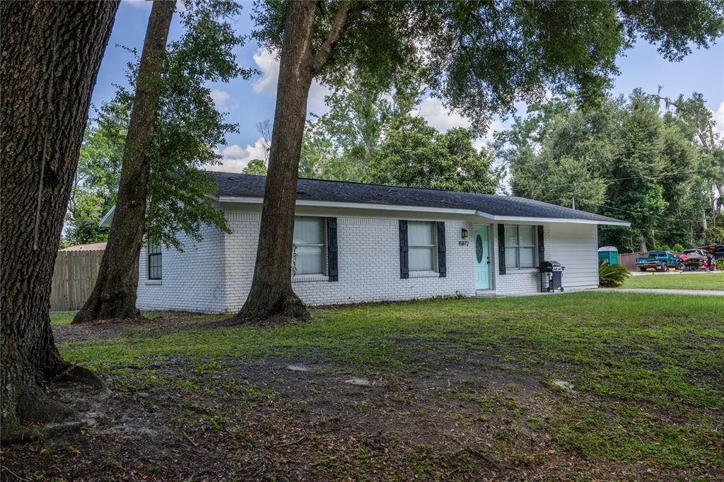 15872 Southwest 133rd Lane Archer, FL 32618 - Photo 6 of 28 a front view of house with yard and green space