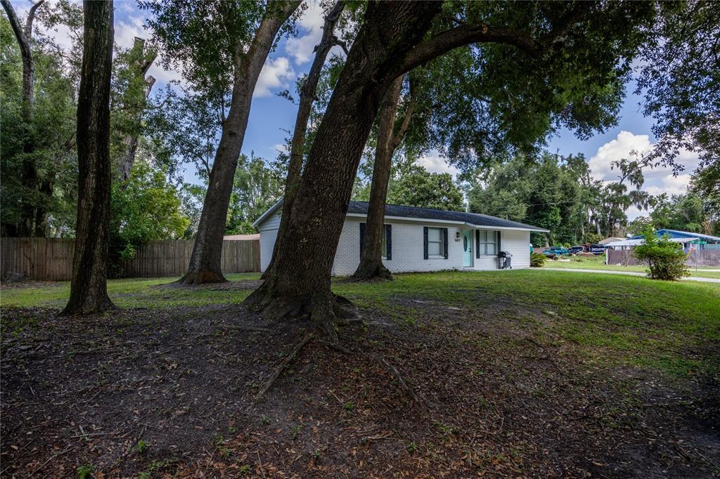 15872 Southwest 133rd Lane Archer, FL 32618 - Photo 7 of 28 a view of house with a backyard