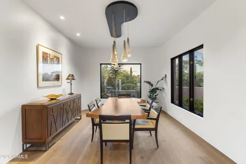 a view of a dining room with furniture window and outside view