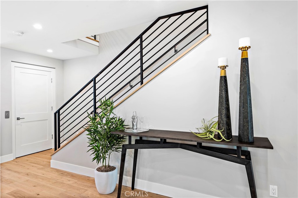 33889 Robles Drive Dana Point, CA 92629 - Photo 15 of 42 a view of staircase with wooden floor and potted plant