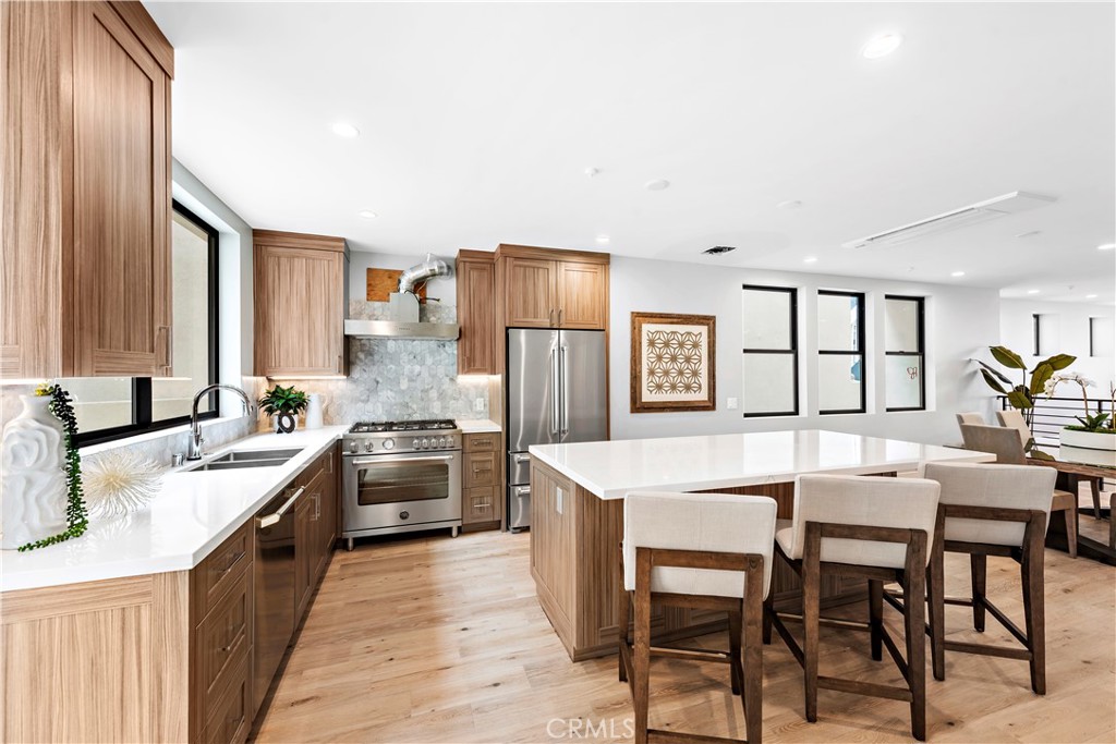 33889 Robles Drive Dana Point, CA 92629 - Photo 18 of 42 a large kitchen with a table and chairs