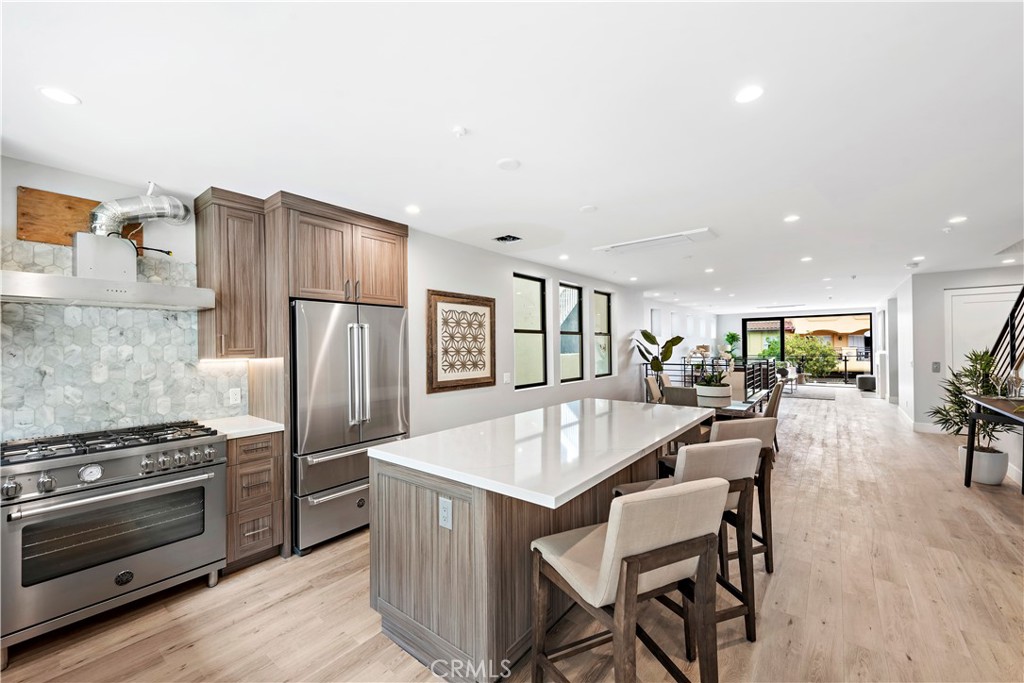 33889 Robles Drive Dana Point, CA 92629 - Photo 19 of 42 a kitchen with stainless steel appliances granite countertop a refrigerator and a stove top oven