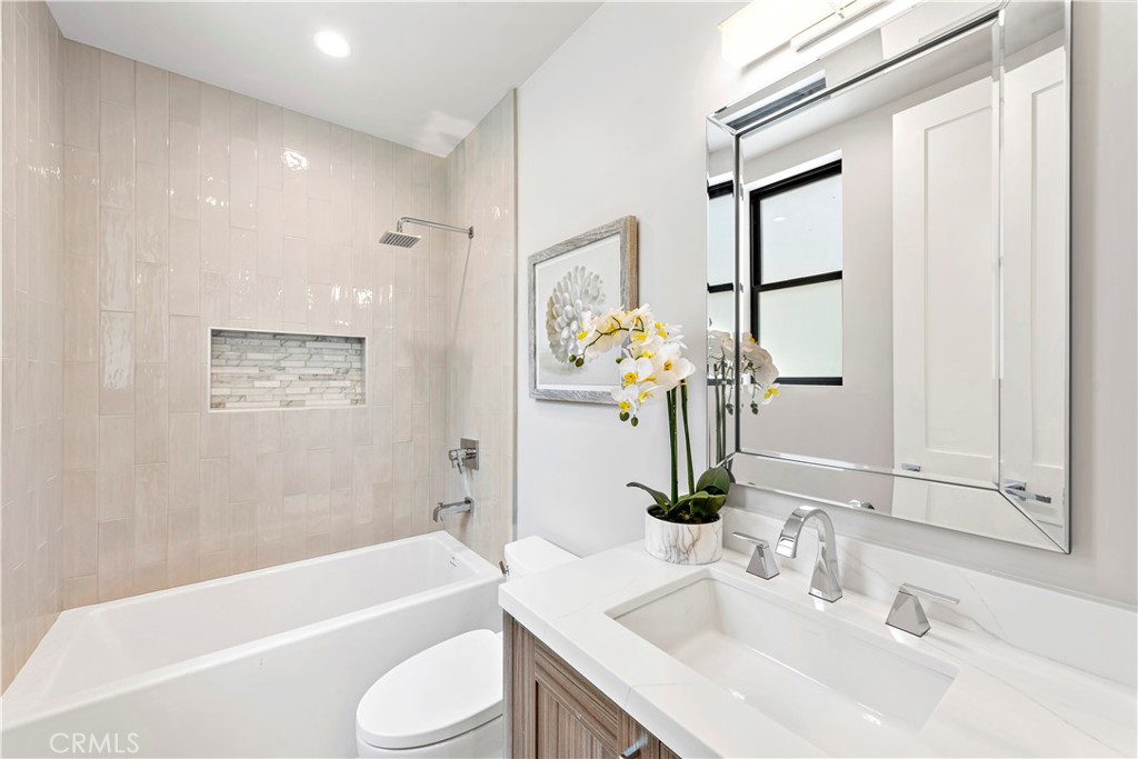 33889 Robles Drive Dana Point, CA 92629 - Photo 25 of 42 a bathroom with a sink a toilet and bathtub