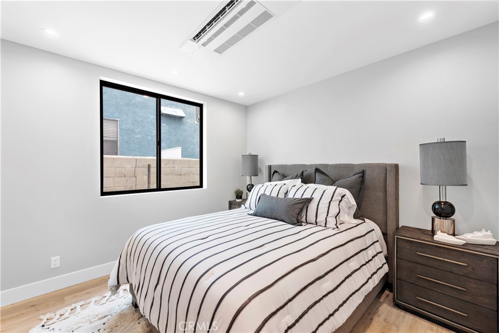 33889 Robles Drive Dana Point, CA 92629 - Photo 26 of 42 a bedroom with a bed and a window