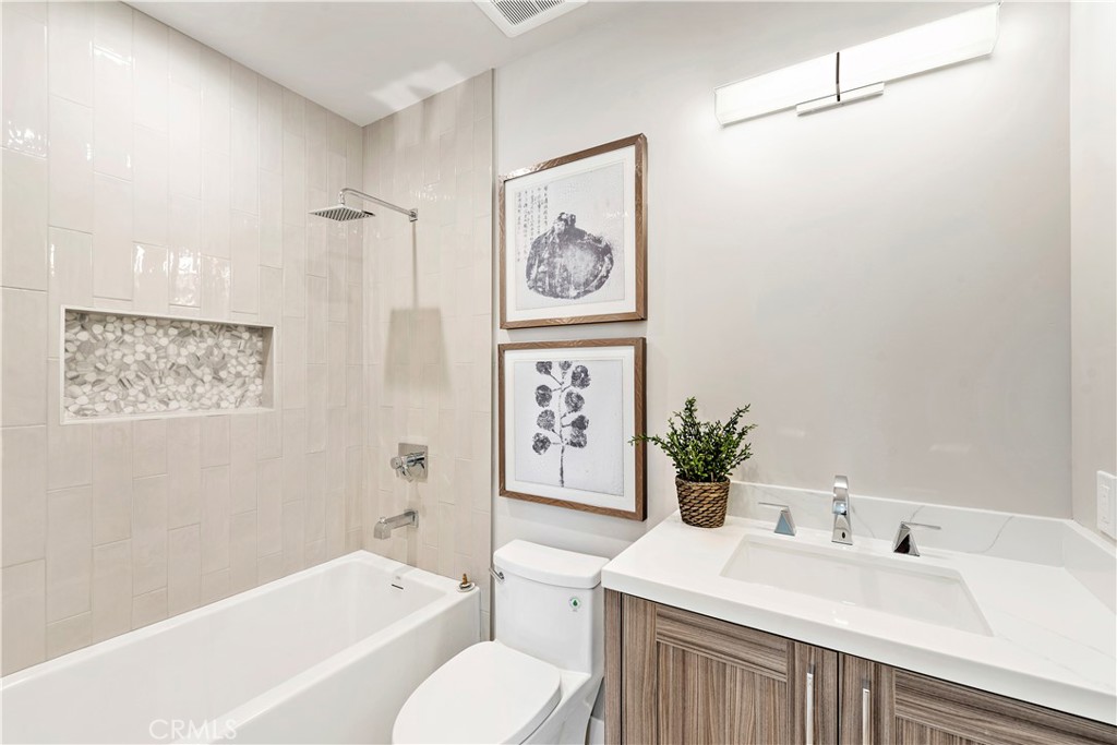 33889 Robles Drive Dana Point, CA 92629 - Photo 27 of 42 a bathroom with a sink a toilet and a bathtub