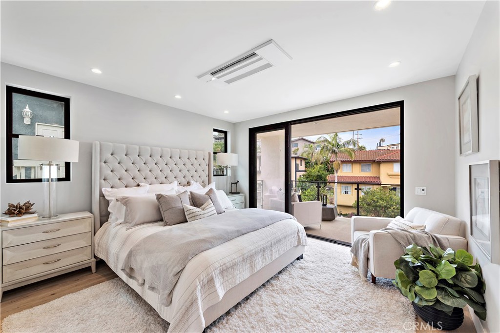 33889 Robles Drive Dana Point, CA 92629 - Photo 28 of 42 a bedroom with a bed mirror and window