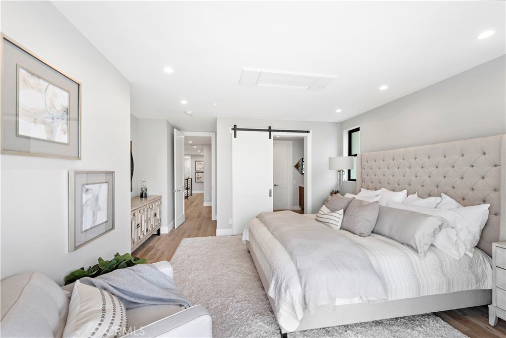 33889 Robles Drive Dana Point, CA 92629 - Photo 30 of 42 a bedroom with a bed and a couch