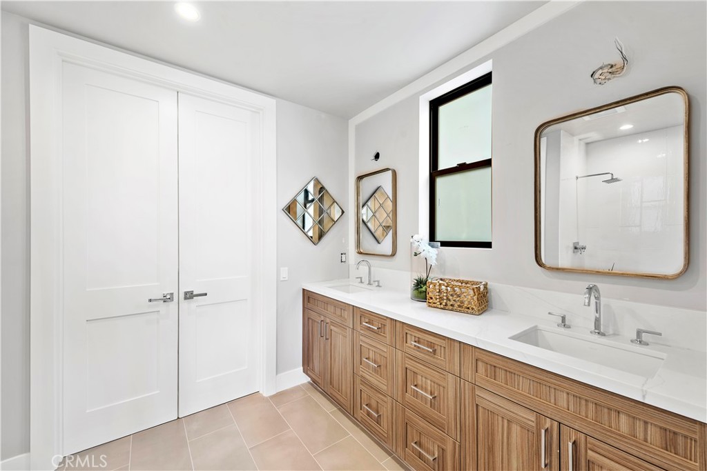 33889 Robles Drive Dana Point, CA 92629 - Photo 31 of 42 a bathroom with a double vanity sink mirror and