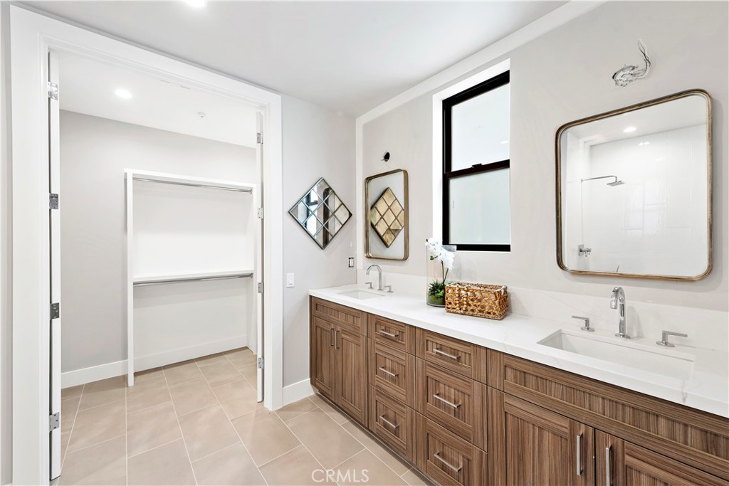 33889 Robles Drive Dana Point, CA 92629 - Photo 35 of 42 a bathroom with 2 sink and a mirror