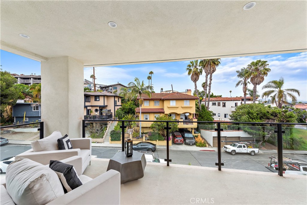 33889 Robles Drive Dana Point, CA 92629 - Photo 36 of 42 a living room with furniture a rug and white walls
