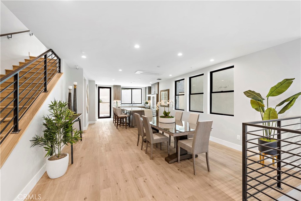 33889 Robles Drive Dana Point, CA 92629 - Photo 9 of 42 a dining room with furniture potted plants and wooden floor