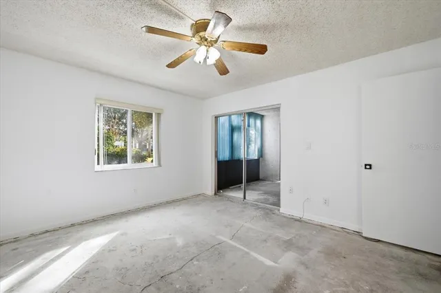 a spacious bathroom with a granite countertop sink mirror vanity and a toilet