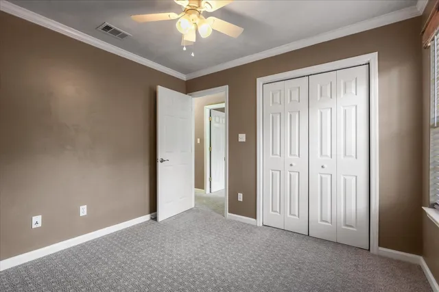 a view of a livingroom with a chandelier fan