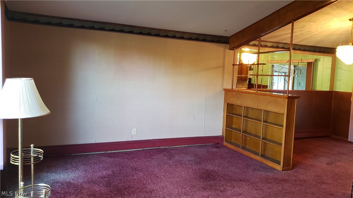 8103 Barnes Road Vermilion, OH 44089 - Photo 7 of 22 Living Room with Dining area at the right. Note beautiful built in bookshelf.