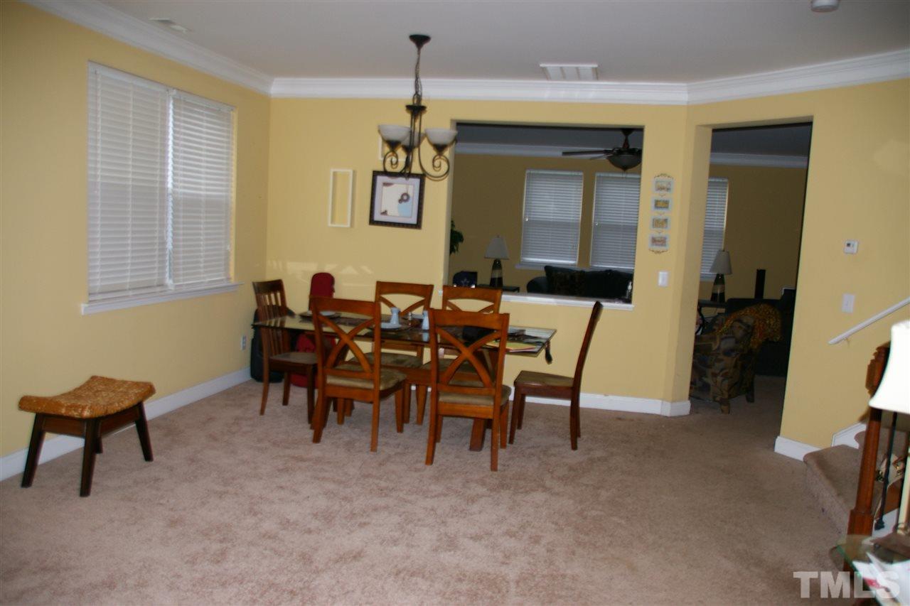 5245 Thornton Road Raleigh, NC 27616 - Photo 5 of 9 a view of a livingroom with furniture and a window