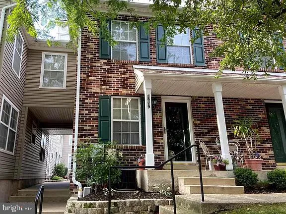 front view of a house with a tree