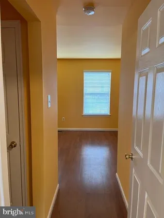 a view of a livingroom with wooden floor