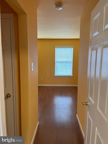 a view of a livingroom with wooden floor