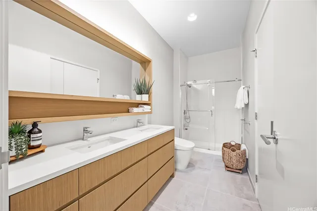 a bathroom with a double vanity sink mirror and double