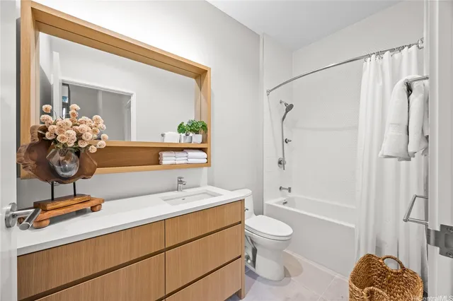 a bathroom with a toilet a sink and a mirror