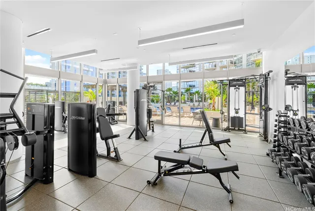 a view of a room with lots of gym equipment