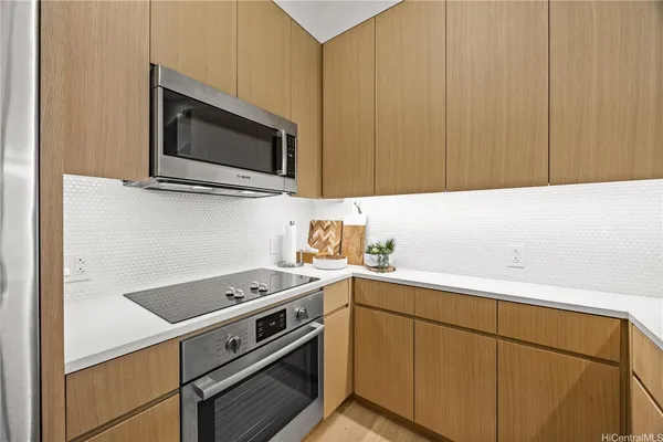 a view of cabinets and wooden floor