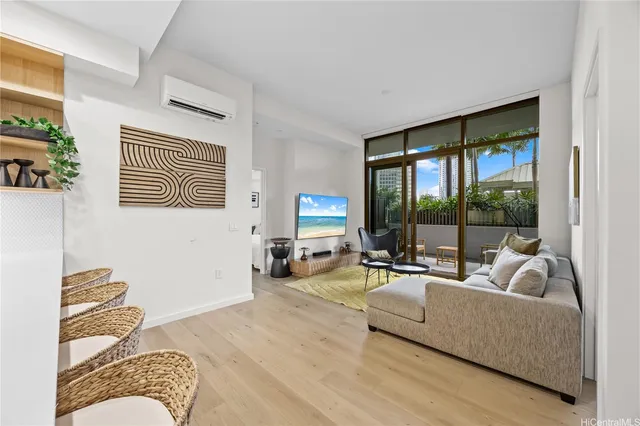a living room with furniture and a large window