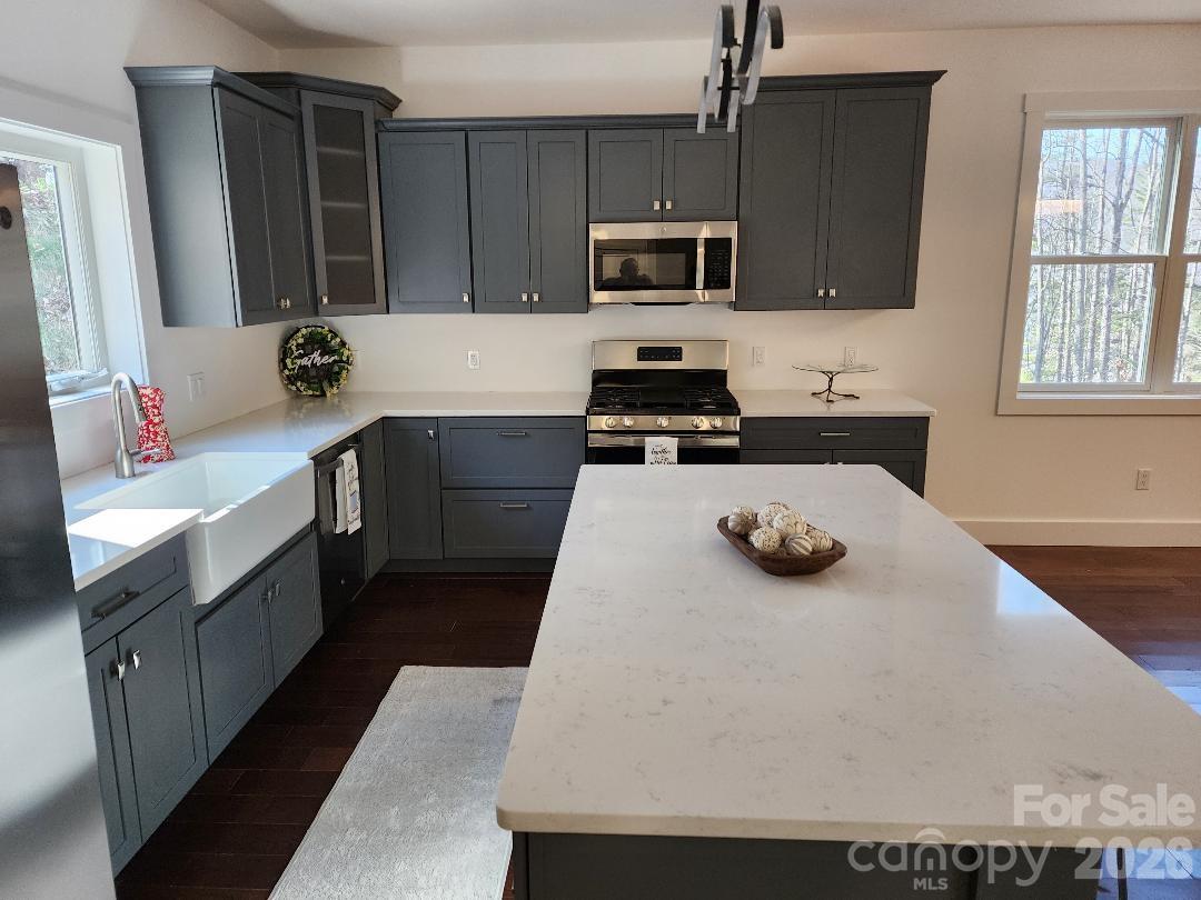 24 Salt Burnsville, NC 28714 - Photo 13 of 42 a kitchen with a stove a sink and a refrigerator