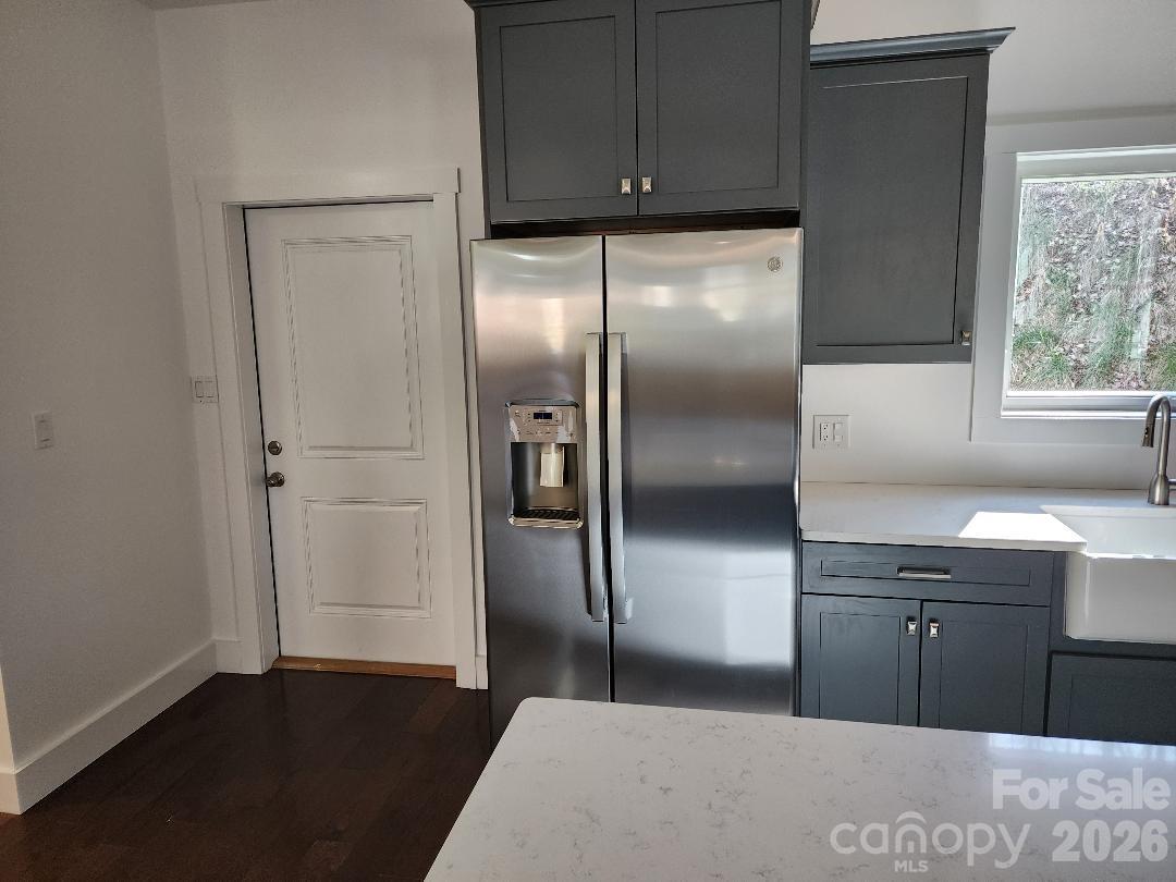 24 Salt Burnsville, NC 28714 - Photo 18 of 42 a kitchen with stainless steel appliances granite countertop a refrigerator a sink and a dishwasher