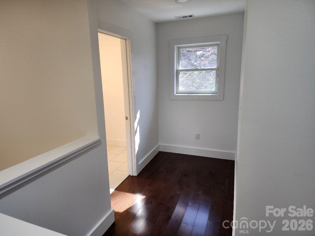 24 Salt Burnsville, NC 28714 - Photo 23 of 42 an empty room with wooden floor and windows