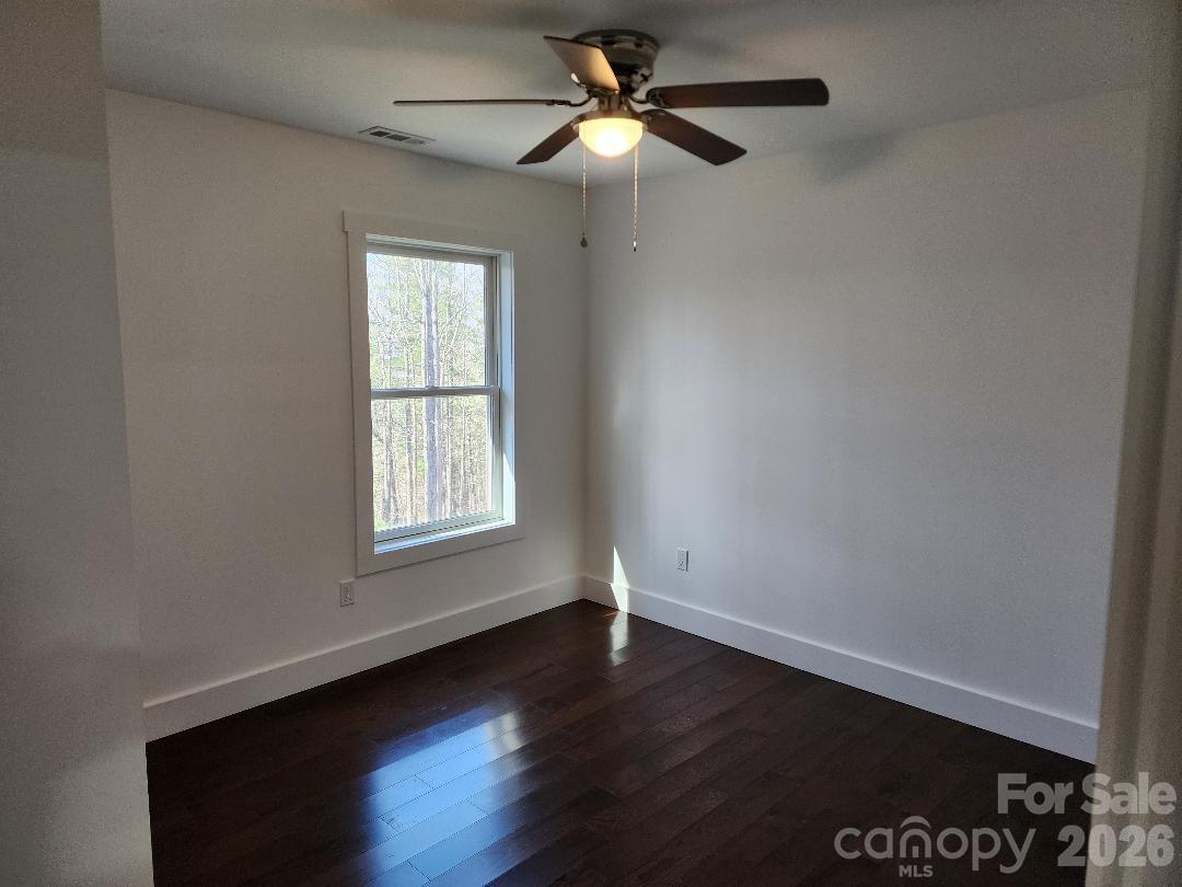 24 Salt Burnsville, NC 28714 - Photo 26 of 42 a view of empty room with wooden floor and fan