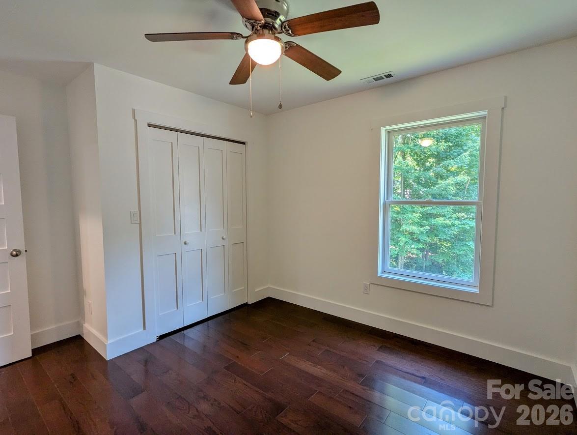 24 Salt Burnsville, NC 28714 - Photo 27 of 42 a view of an empty room with wooden floor and a window