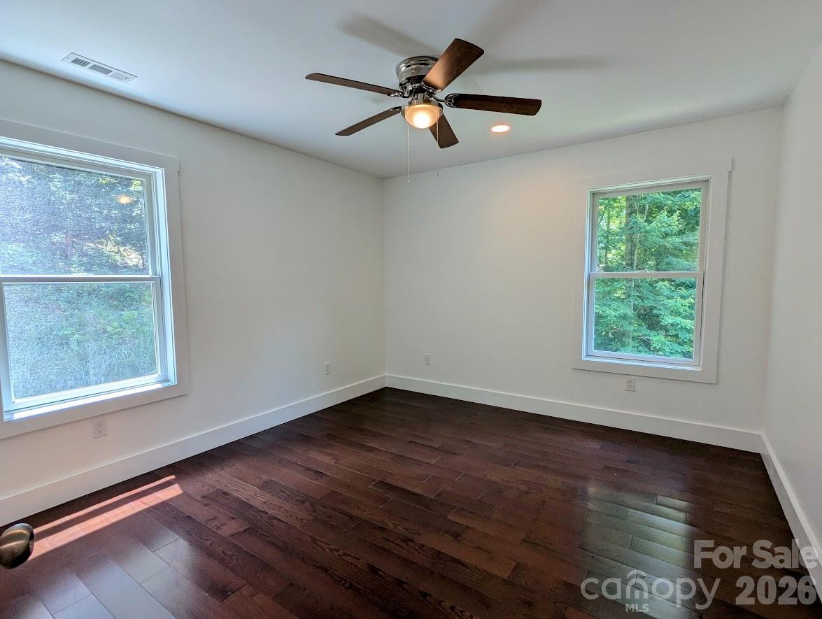 24 Salt Burnsville, NC 28714 - Photo 28 of 42 a view of an empty room with wooden floor and a window
