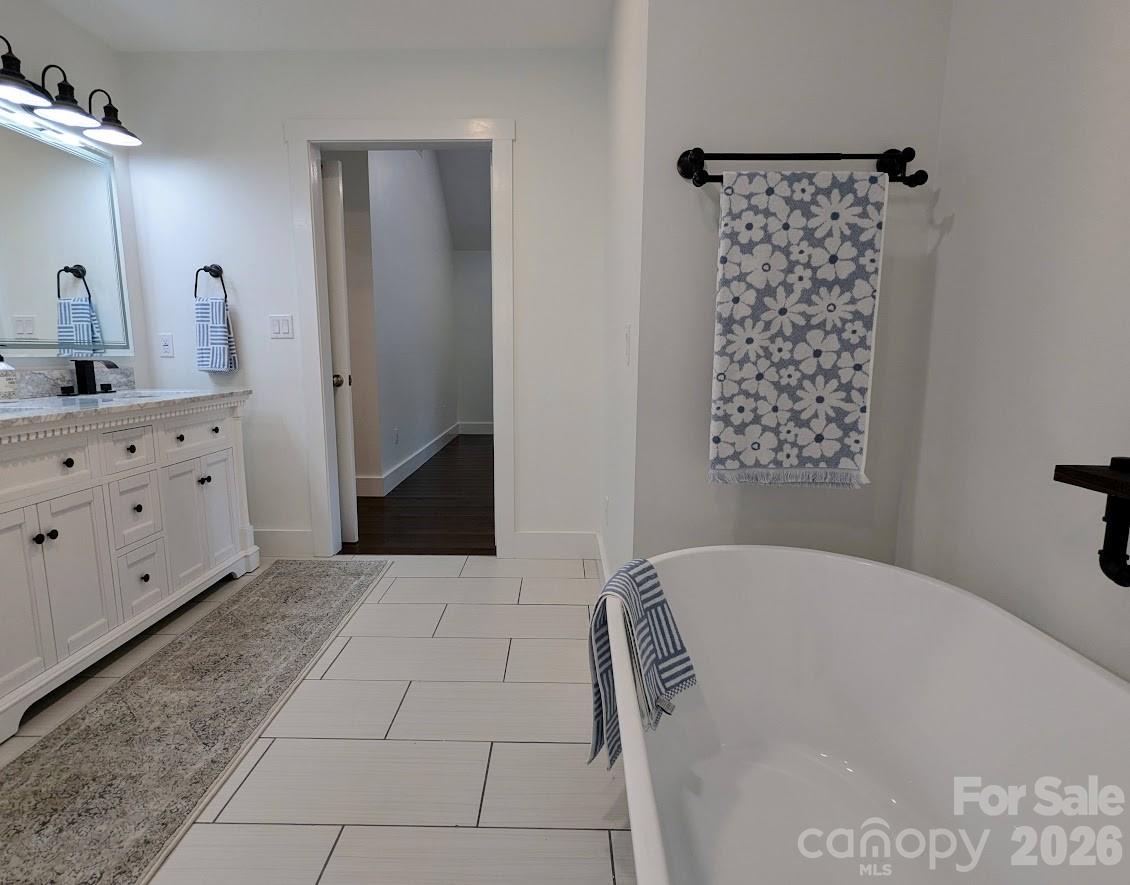 24 Salt Burnsville, NC 28714 - Photo 39 of 42 a bathroom with a bathtub and a shower