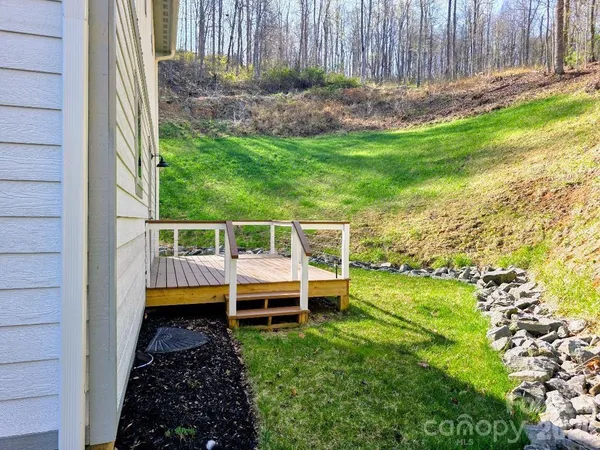 a view of a backyard with plants and garden