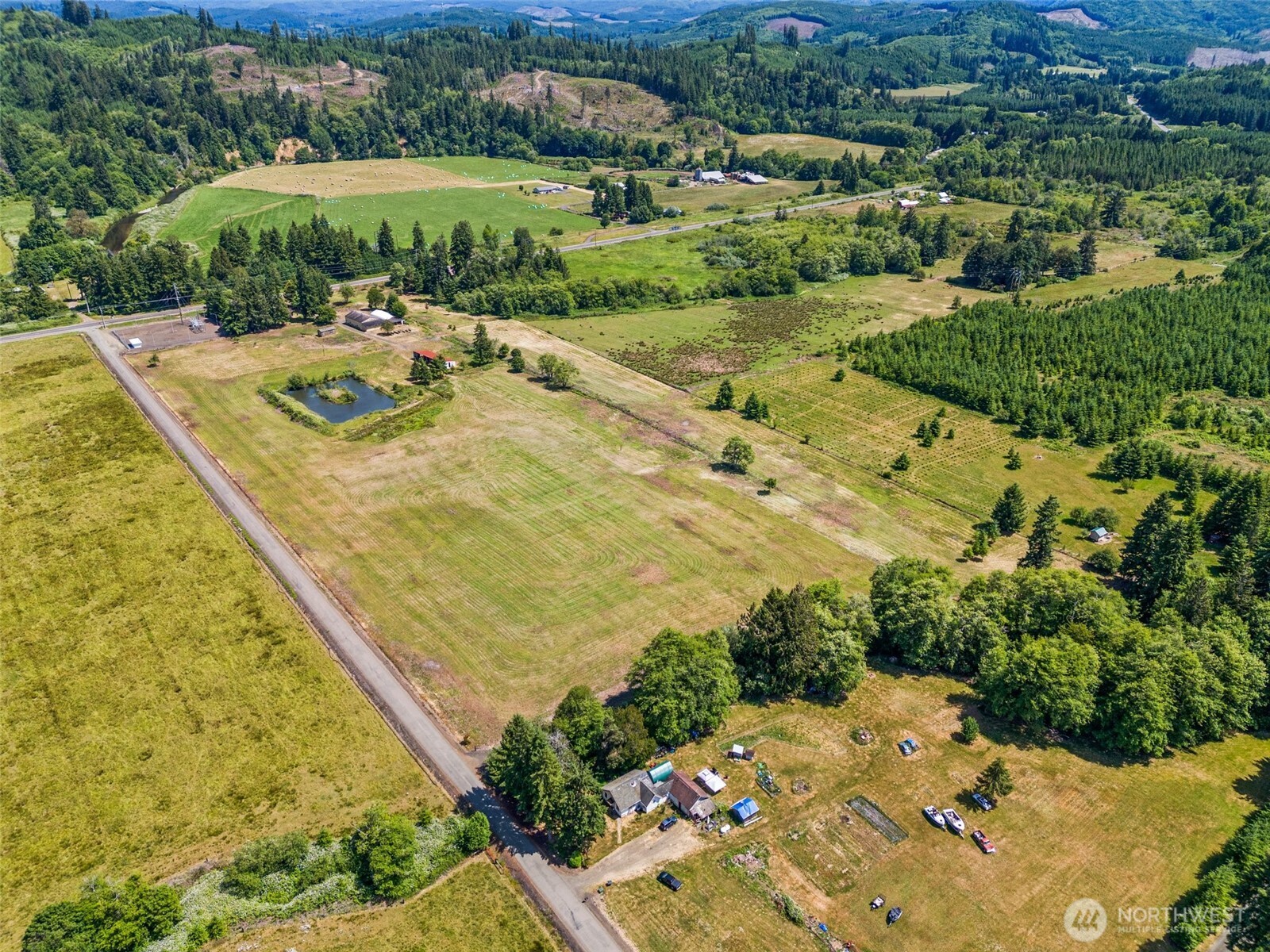 1608 SR 6 Raymond, WA 98577 - Photo 12 of 12 an aerial view of a house with a yard and lake view