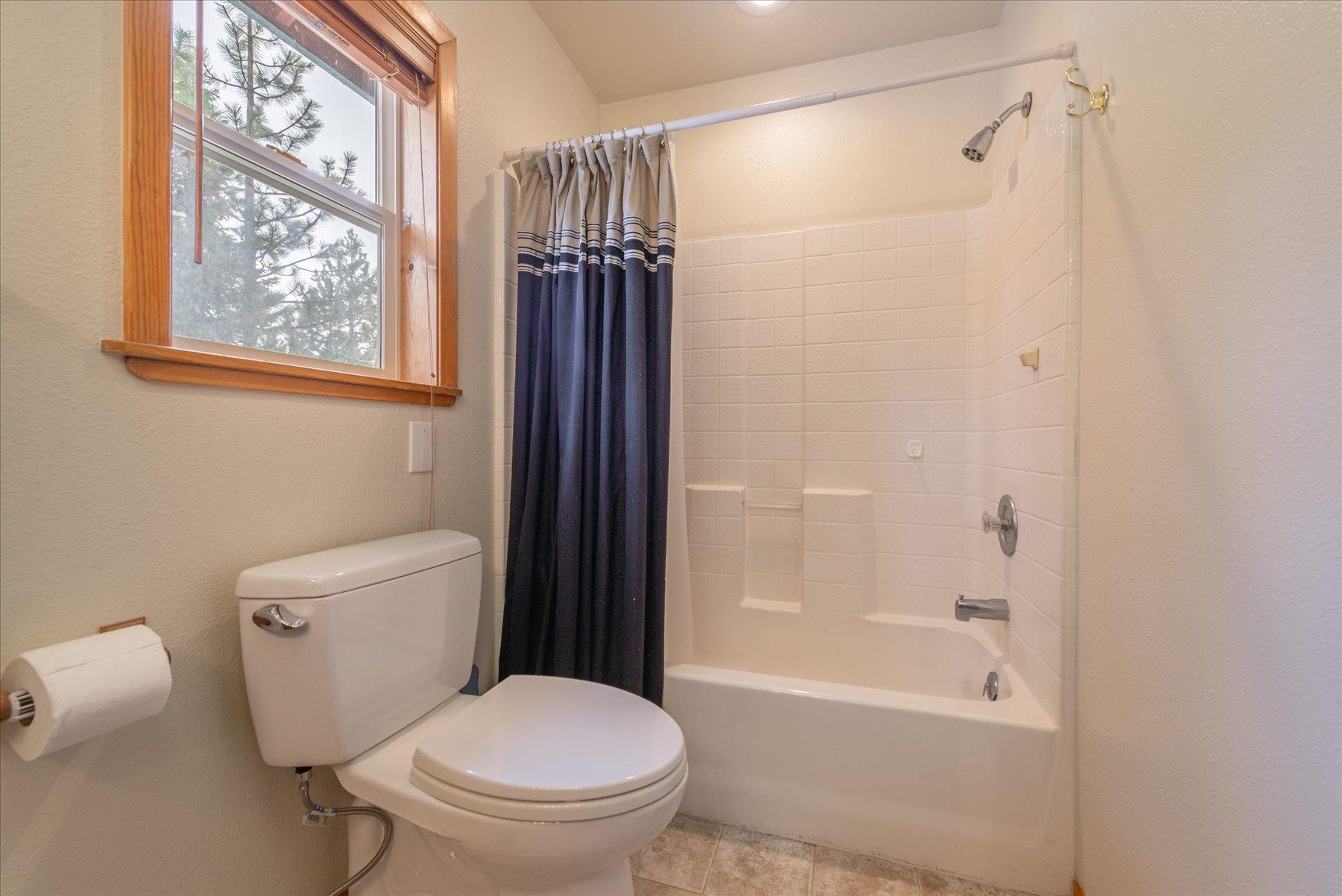 14236 Wolfgang Road Truckee, CA 96161 - Photo 13 of 21 a bathroom with a toilet and a shower