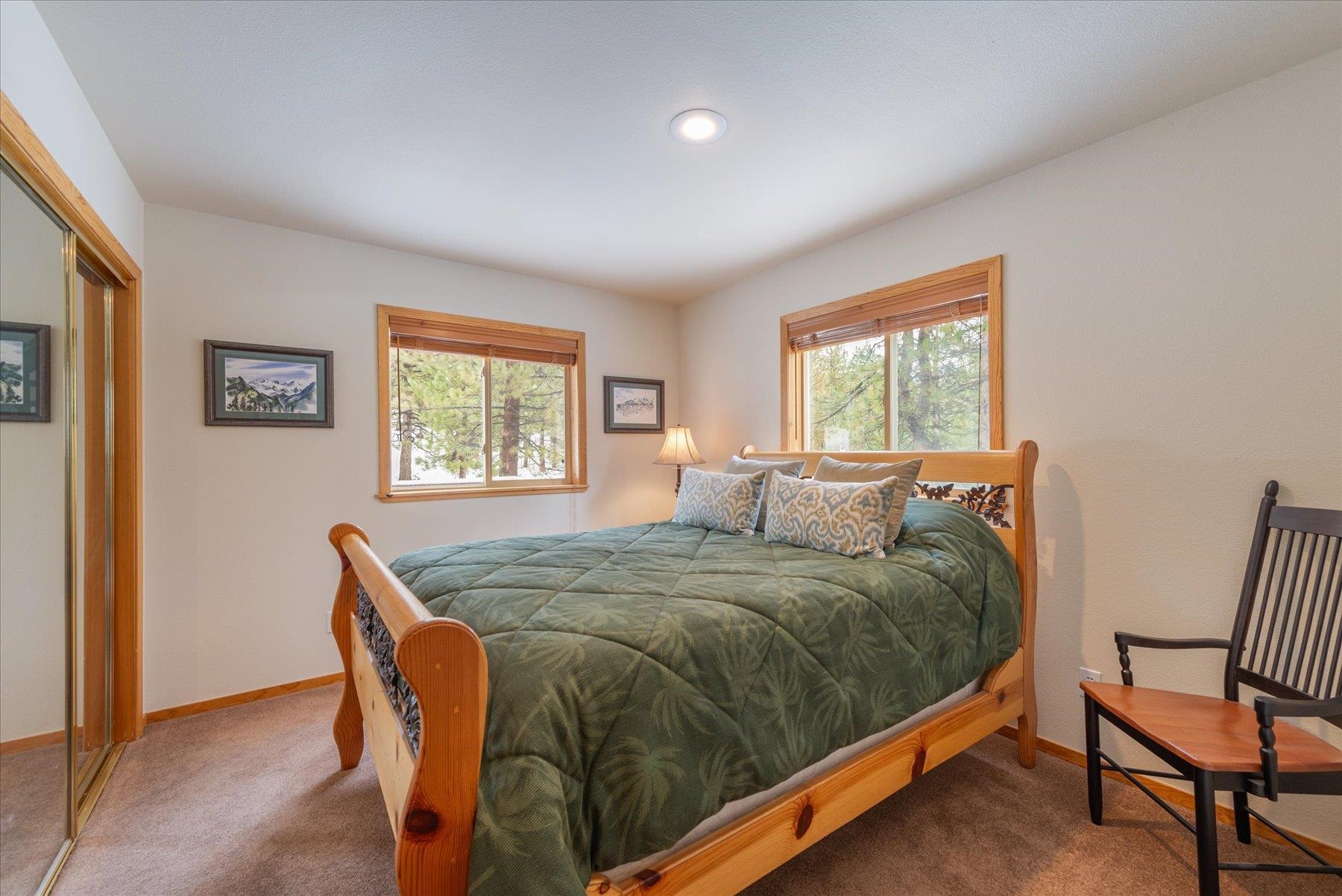 14236 Wolfgang Road Truckee, CA 96161 - Photo 14 of 21 a bedroom with a bed and windows