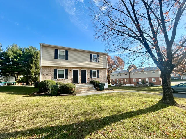 a front view of a building with garden
