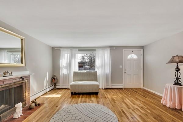 12 Penny Road Woburn, MA 01801 - Photo 3 of 19 a bedroom with furniture and a window