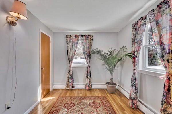 12 Penny Road Woburn, MA 01801 - Photo 10 of 19 a view of a room with window and wooden floor