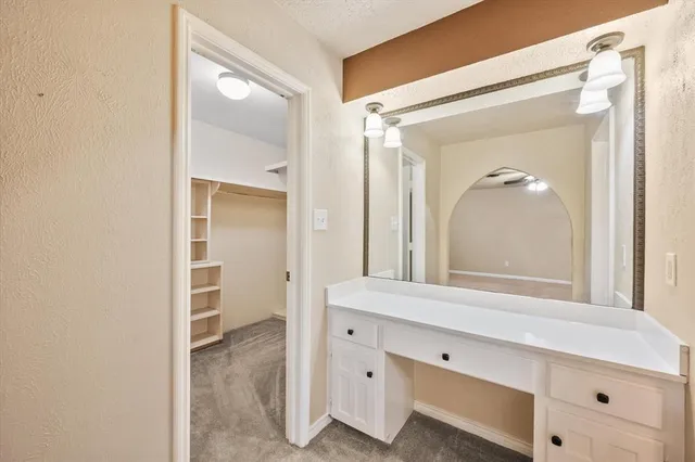 a bathroom with a sink a mirror and a shower