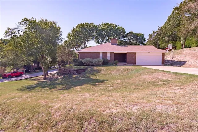 a view of a backyard of the house