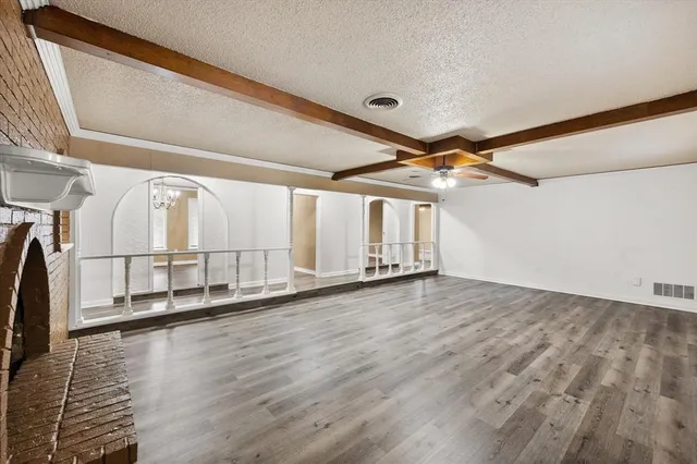a view of a hardwood & staircase in a room