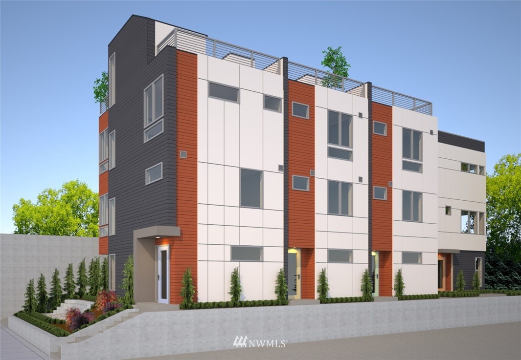 a front view of a building with potted plants