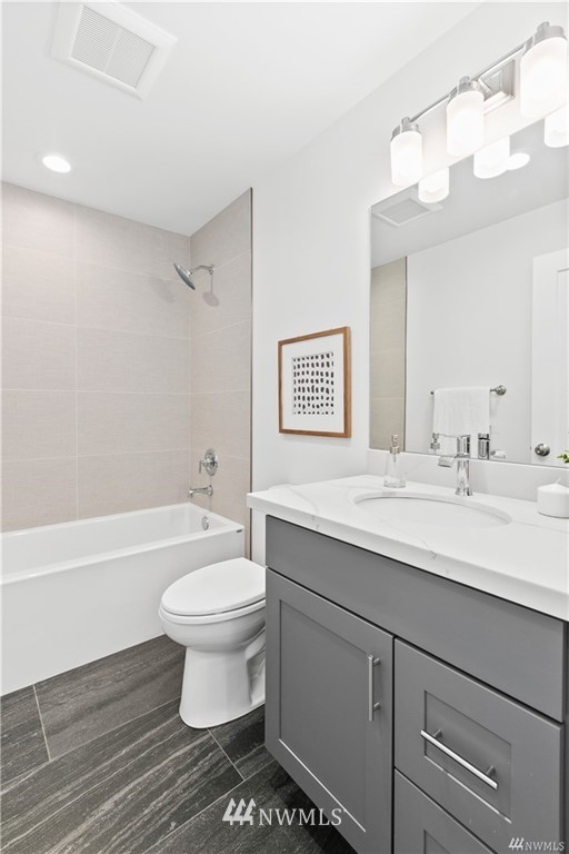 716 North Allen Place Seattle, WA 98103 - Photo 4 of 5 a bathroom with a sink a toilet and a bathtub