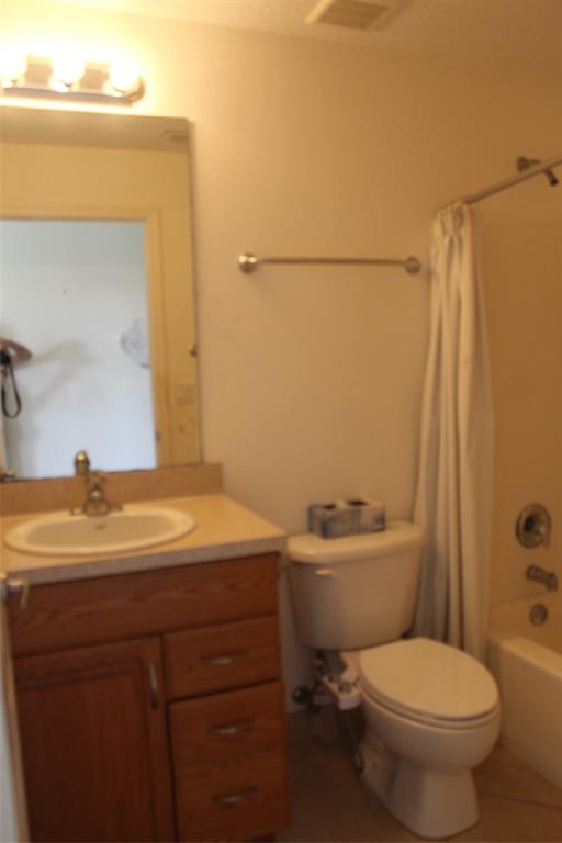 2422 Southeast 33rd Street Okeechobee, FL 34974 - Photo 11 of 32 a bathroom with a sink a toilet and shower